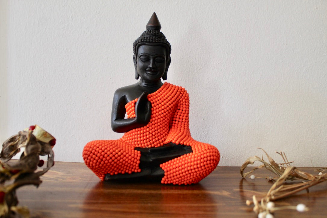 buddha statue Protecting Buddha ,wood, wearing turquoise stones painted orange. He is 8 inches height and 6 inches width at knees.